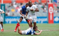 Perry Baker goes for the line against France. Photo World Rugby.