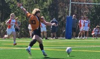 Jameson Beatty kicks for goal. Photo Michelle Ulusoy.