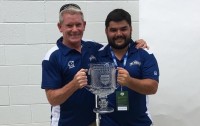 Breda with the CRC Philly Bracket trophy for Mount St. Mary's in 2017.