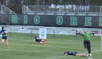 Ashley Cowdrey scores her first try despite the best efforts of the QUC defense. Rory Goff photo.