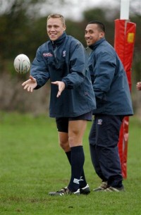 Paul Emerick and Albert Tuipulotu sharing a laugh during warmups on tour in Italy in 2004. USA Rugby photo.