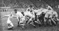 Scholz and his opposite number contest for the ball in the 1924 Olympic final between France and the USA. 