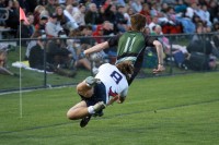 Caden Syddall tackles Olympus speedster Jackson Bennee. Photo Tonio McPeak.