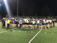 Players from St. Ignatius and St. Edward huddle up after the 2018 state final. Allison Bradfield photo.
