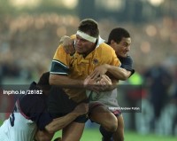 Vaea Anitoni tackles Australia's Tiaan Strauss during the 1999 Rugby World Cup. Photo ©INPHO/Andrew Paton.