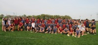 Aquinas and Jesuit players pose together after a hard-hitting game. Alex Goff photo.