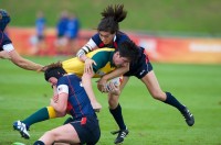 Jossie Tseng makes a tackle during the USA's defeat of Australia in the 2014 RWC. Ian Muir photo.