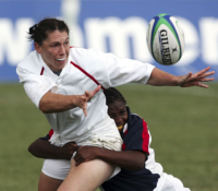 Warner makes a tackle in the 2006 Rugby World Cup. Photo RWC.