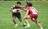 Tony Reid fends off a tackler. Nikki McGettigan photo.