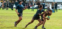 Kolo Kahanu making a tackle.