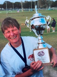 Liz Kirk with the 2000 USA Rugby All-Star Championship trophy, won by Kirk's Pacific Coast team. Photo courtesy Liz Kirk