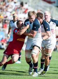 Lou Stanfill fending off a tackler against Canada in 2014. David Barbal photo.