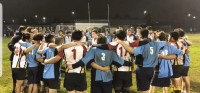 Marina and Wilson HS players gather post-game.