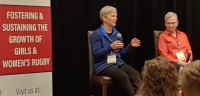 Martha Daines speaking at the WRCRA Conference while Liz Kirk listens attentively.