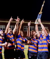 The Marvin Ridge players raise the trophy.