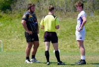 Matt Weiner of Aspetuck, left, and Burke Carroll of Gonzaga, right, meet with the ref. Photo Gonzaga Rugby.