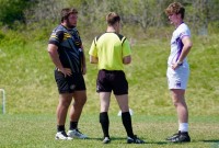 Matt Weiner of Aspetuck, left, and Burke Carroll of Gonzaga, right, meet with the ref. Photo Gonzaga Rugby.