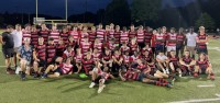 Both teams pose post-game.