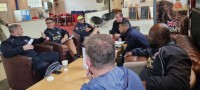 Coaches discuss who and what over coffee. Alex Goff photo.