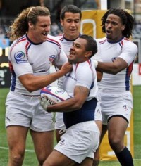 Jone Naqica gets congratulated after scoring for the USA Men's 7s team. Numina Photo.