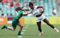 Naya Tapper fending off some attention. Mike Lee KLC fotos for World Rugby.