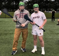 Norwich Coach Bob Weggler, left, shows off his hurling gear.