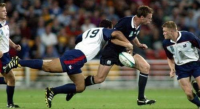 Olo Fifita makes a thumping tackle against Scotland in the 2003 Rugby World Cup. Photo World Rugby.