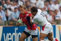 Paul Emerick fending off some attention in the 2007 Rugby World Cup. Ian Muir photo.