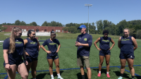 New Head Coach Danny Harlow speaks with his team during training
