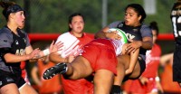 Reece Woods lays in a massive tackle against Army. Photo Gregory Vasil Iconic Sports Imagery.