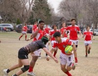 Regis Jesuit in red and Palmer in black. Photos Regis Jesuit Rugby.