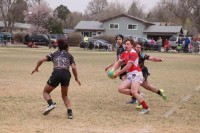 Regis Jesuit in red and Palmer in black. Photos Regis Jesuit Rugby.