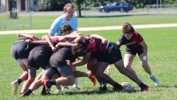 Scrumhalf Jake Stelluti works the back of the scrum.