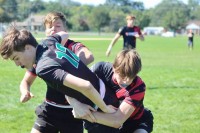 Matt Cleland and Cole Boyer combine on a tackle.