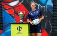 USA captain Kate Zackary poses with the World Cup trophy. Photo Rugby World Cup.