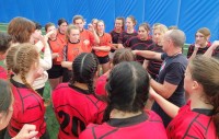 Salty Thompson breaking down the session with the HS girls. Alex Goff photo.