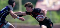 Jonathon Soloman fends off attention as San Diego Mustangs lead in SoCal. Photo Adam Taich.