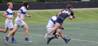 Teagan Frain gets tackled. Photo Preston Bucsanyi.