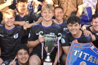 The St. Augustine players take the regular season cup and the Titan Shield. Bill Strack photo.