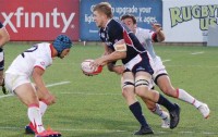 Lou Stanfill readies an offload against Georgia. Philippa Snyman photo.