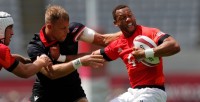 Team GB's Dan Norton fends off the Canada co-captain Harry Jone. Photo Mike Lee - KLC fotos for World Rugby