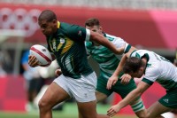 South Africa's Zain Davids bursts through the Ireland defense. Photo Mike Lee - KLC fotos for World Rugby