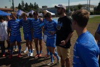 Ashe chats with his team post-match.