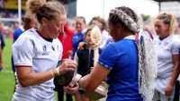 Captains exchange gifts post-match. Photo Molly Davidson for World Rugby via Getty Images.