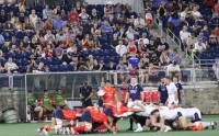 Scrum time. Alex Goff photo.