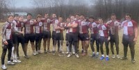 West and muddy Vienna players post-match.