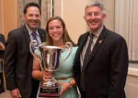 Hope Rogers shows off her 215-16 MA Sorensen Award with Chuck Nelson and Wayne Milner of the Washington Athletic Club in Seattle