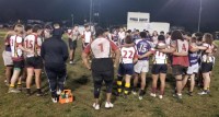 Wilson and Saint Anthony's players huddle up as a group after the game.