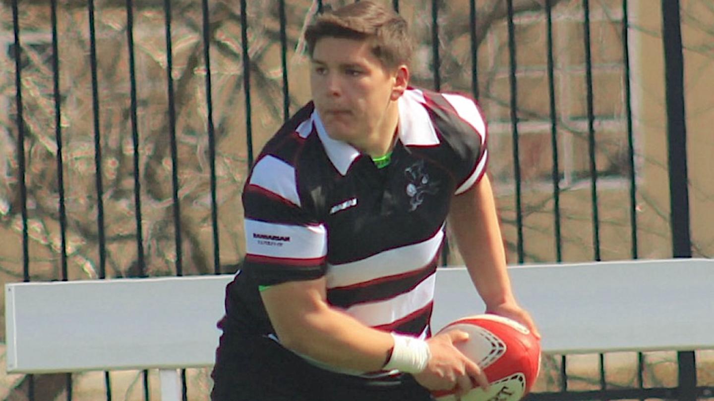 Jacob Ortiz passes the ball out for the Benedictine Black Monks.