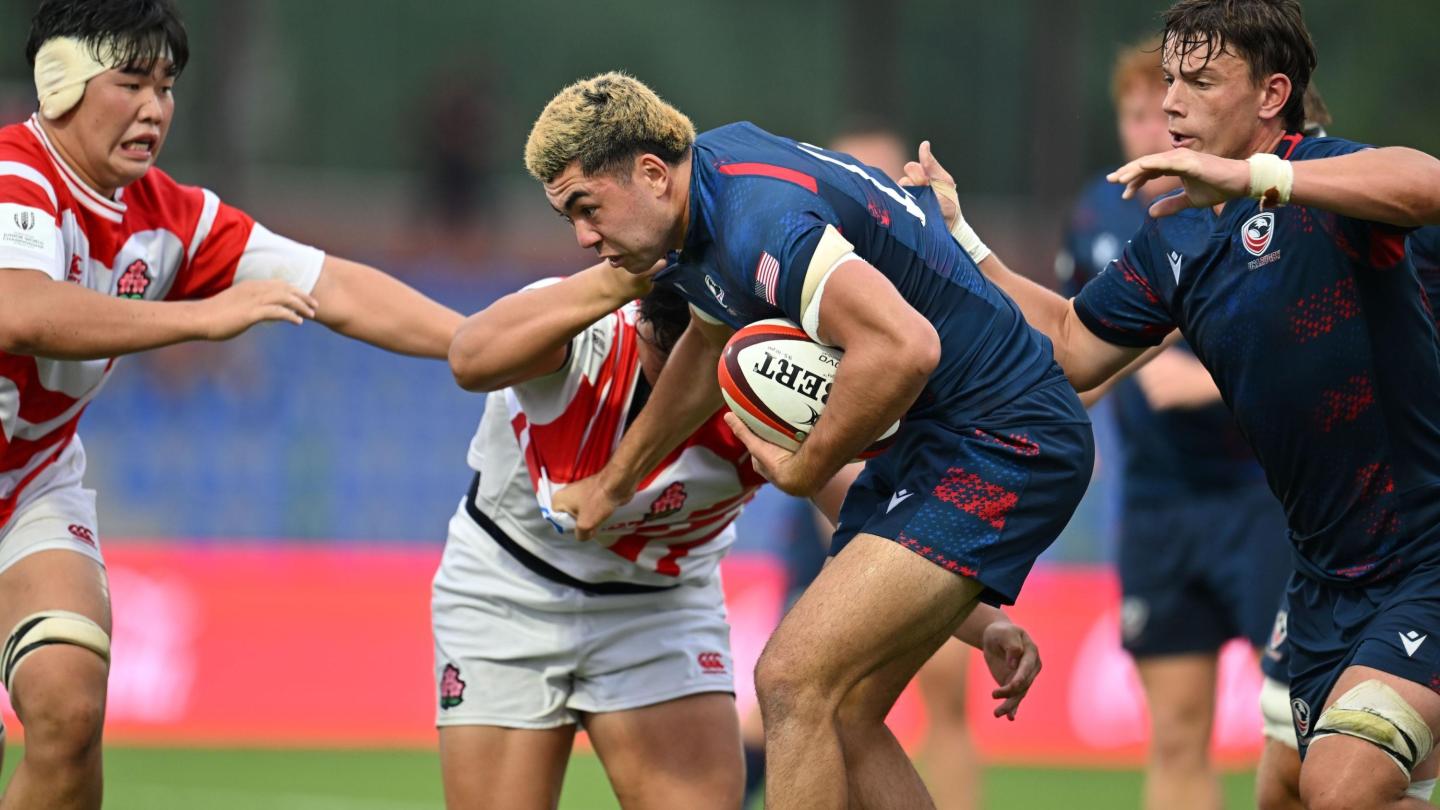 Dane Mitchell works his way through the Japan defense. Photo Levan Verzeuli for World Rugby.